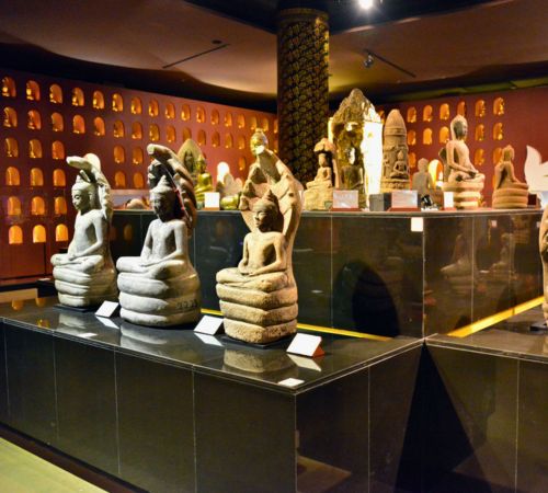 Ancient stone Buddha statues on display in a gallery at the Angkor National Museum near Blanc Smith Hotel in Siem Reap.