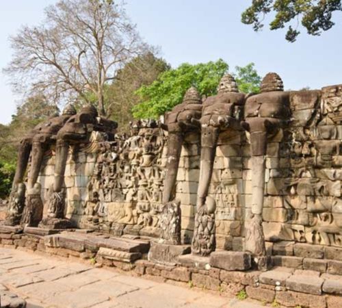 The stone elephant carvings and relief walls at the Terrace of the Elephants in Angkor Thom near Blanc Smith Hotel in Siem Reap.