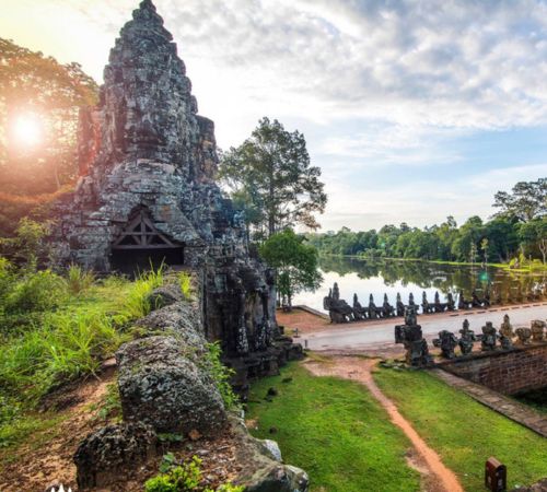 The historic stone entry gate and bridge over the moat at Angkor Thom near Blanc Smith Hotel in Siem Reap.