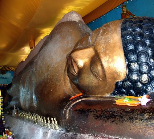 The large stone Reclining Buddha statue at Preah Ang Thom on Kulen Mountain near Blanc Smith Hotel in Siem Reap.