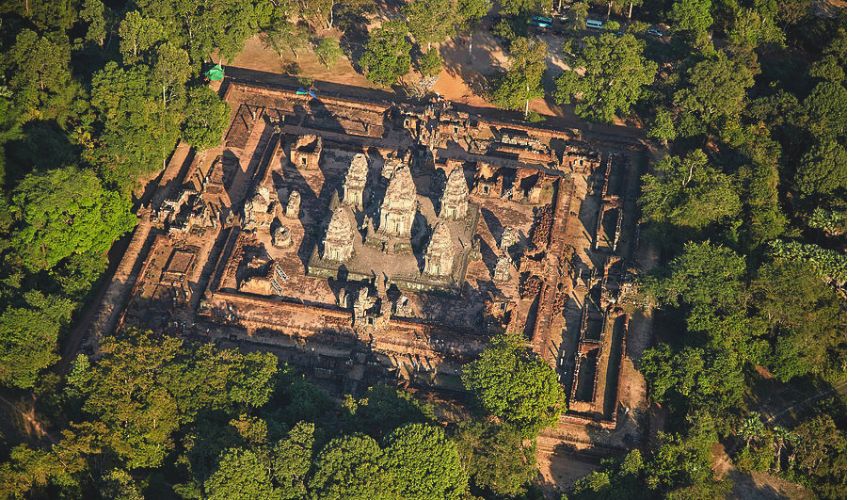 An aerial view of the stone tiers and brick sanctuary towers of East Mebon temple near Blanc Smith Hotel in Siem Reap.