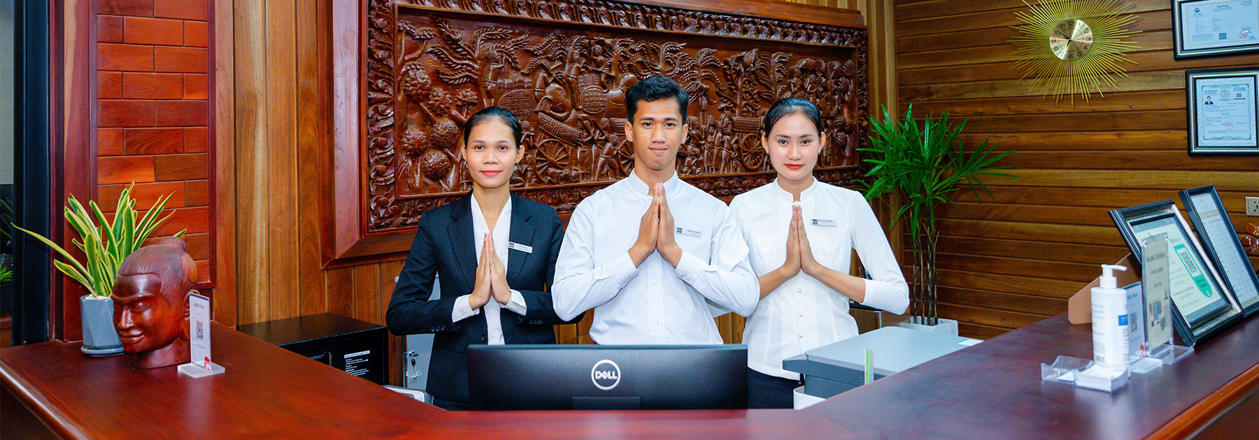 Our professional 24-hour reception desk team welcoming you to Blanc Smith Hotel with traditional Cambodian hospitality.